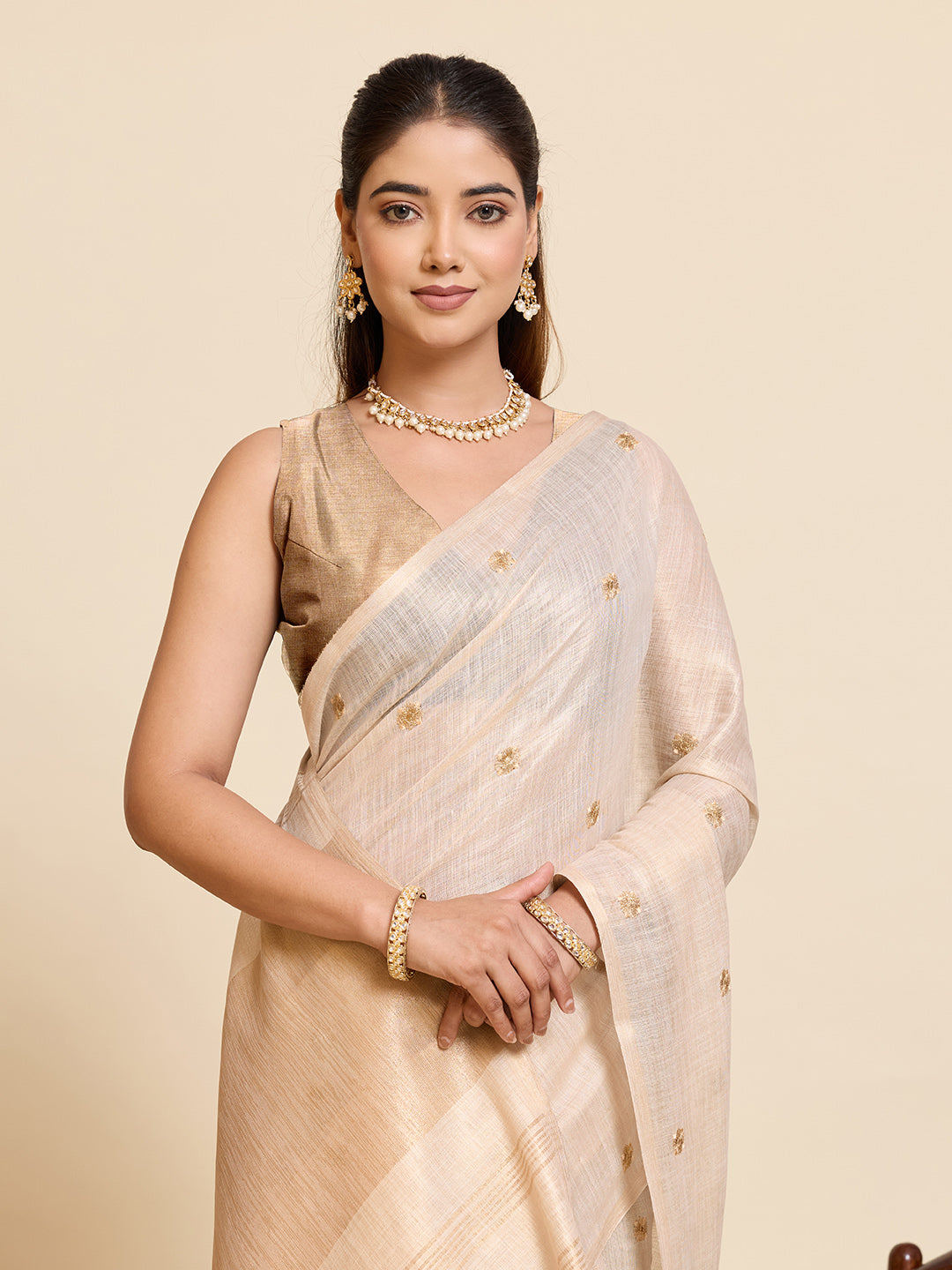 Fabrica Vibe Ivory Linen Cotton Saree with  Embroidery and Golden Woven Motifs & Elegant Tassels